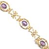 An early 20th century gold garnet-topped-doublet and split pearl bracelet. Of scrolling design, the
