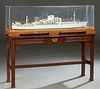 S. T. V. "Malaysia Kita," 1953, rebuilt in 1971, metal ship's model by Chantiers Navals de la Ciotat, with a plexiglass cover, on a carved mahogany st
