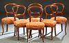 Set of Six French Carved Walnut Louis Philippe Dining Chairs, 19th c., the arched curved medallion back over a bowed upholstered seat, on cabriole leg