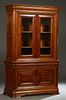 French Louis Philippe Style Carved Cherry Buffet a Deux Corps, early 20th c., the stepped rounded corner crown over double wide beveled glazed doors, 