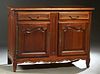 French Provincial Louis XV Style Carved Cherry Sideboard, 20th c., the stepped rounded corner top over two frieze drawers above double fielded panel c