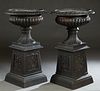 Pair of Cast Aluminum Victorian Style Campana Form Jardinieres, 20th/21st c., the everted relief decorated rim above lobed baluster sides, on a slopin