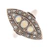 A late Victorian 9ct gold opal and diamond dress ring. Of marquise-shape outline, the graduated circ