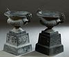 Pair of Cast Iron Campana Form Jardinieres, 20th/21st C., the everted relief rims over handled baluster sides, on an integral square base, on a steppe