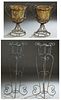 Group of Four Cast Iron Garden Decorations, 20th/21st c., consisting of a pair of tall plant stands on scrolled supports; together with a pair of scro