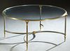 Contemporary Brass and Iron Glass Top Coffee Table, 20th c., the circular glass, on tapered brass and iron legs, joined by demilune iron stretchers, H