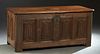 French Provincial Louis XIII Style Oak Coffer, 19th c., the canted corner rounded edge top over a front and sides with carved linenfold panels, on blo