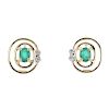 A pair of emerald and diamond ear studs. Each designed as an oval-shape emerald, with single-cut dia