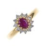 An 18ct gold ruby and diamond cluster ring. The oval-shape ruby, within a brilliant-cut diamond surr