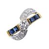 An 18ct gold sapphire and diamond ring. The brilliant-cut diamond, to the square-shape sapphire line