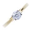 An 18ct gold diamond single-stone ring. The circular-cut diamond, to the tapered band. Diamond weigh
