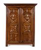 A Louis XIII Style Carved Walnut Armoire