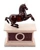 An Italian Bronze Model of a Horse on a White Marble and Porphyry Base
