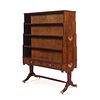 A Regency Style Figured Rosewood Double-Sided Bookcase on Stand