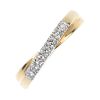 An 18ct gold diamond crossover band ring. The brilliant-cut diamond line crossover centre, to the ta