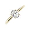 An 18ct gold diamond single-stone ring. The oval-shape diamond, to the tapered shoulders and plain b