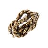 A 9ct knot ring. The rope-twist stylised knot, to the plain band. Hallmarks for Birmingham, 1976. We