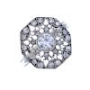 A diamond cluster ring. Of openwork design, the brilliant-cut diamond collet, within a single-cut di