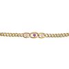 A ruby and diamond bracelet. The circular-shape ruby and old-cut diamonds, each within a curb link,