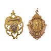 Two early 20th century 9ct gold medallions. The first designed as a shield with scrolling openwork s