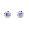 A pair of 9ct gold tanzanite and diamond ear studs. The circular-shape tanzanite, within an illusion