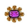 An early 20th century gold gem-set brooch. The octagonal-shape amethyst, to the petal surround with