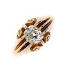 A gentleman's Edwardian 18ct gold diamond single-stone ring. The old-cut diamond, with scrolling acc