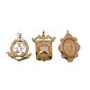 Three early 20th century 9ct gold pendants. To include a royal military police pendant, an engraved