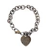 TIFFANY & CO. - a silver charm bracelet and additional tag. The belcher-link chain suspending a hear