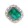 (539356-1-A) An 18ct gold emerald and diamond cluster ring. The rectangular-shape emerald, within a
