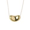 (544516-3-A) TIFFANY & CO. - an 18ct gold 'bean' pendant. The stylised bean, suspended from an integ