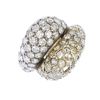 (546218-1-A) A diamond dress ring. Comprising two pave-set diamond crossover panels, to the asymmetr