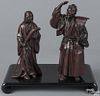 Pair of Japanese patinated bronze figures of a man and a woman with a rake and a broom, 9 3/4'' h.