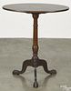 George III style mahogany tea table, 29 1/2'' h., 23 3/4'' w., together with a mahogany candlestand