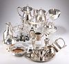 A COLLECTION OF SILVER-PLATE, including large spot-hammered