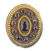 A mid 19th century garnet brooch. Of oval outline, the cushion-shape foil-back garnet, to the circul