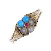 A late Victorian gold gem-set memorial ring. The turquoise, split pearl and red gem floral cluster,