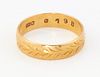 A GOLD BAND RING, with engraved laurel band decoration, par