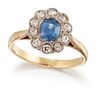 AN 18CT GOLD SAPPHIRE AND DIAMOND CLUSTER RING, an oval-cut