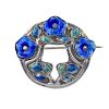 MURRLE BENNETT - a silver enamel brooch. Of circular outline with blue enamel flower and green/blue