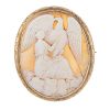 A cameo brooch. The oval cameo depicting Hebe holding a cup for her father Zeus, who is represented