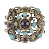 An Austro-Hungarian garnet and turquoise clasp. Of openwork floral design, the circular garnet caboc