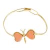 A coral butterfly bangle. Designed as a butterfly, with coral wings, to the articulated bangle. Cora