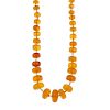 A natural amber necklace. The forty-five graduated natural amber beads measuring 8 to 20mm, to the s