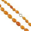 A natural amber necklace. Comprising forty-five oval-shape, graduated natural amber beads measuring