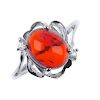 A natural Burmese blood amber ring. The blood amber cabochon, measuring 0.7cms, to the scrolling sur