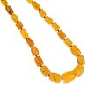 A natural amber bead necklace. Comprising forty-five barrel-shape beads, measuring 1.1 to 2.2cms. Le