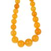 A graduated natural amber necklace. Comprising forty-five graduated beads measuring 1.8 to 0.9cms. L