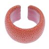 A dyed pink stingray cuff. Signed Maximos. Inner diameter 5.2cms. Width 4cms. <br><br>Overall condit
