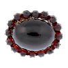 A gem necklace, a paste necklace and a garnet and paste brooch. The oval-shape cabochon garnet with